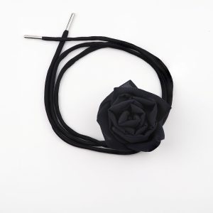 Black silk rose choker necklace with adjustable satin lace by ByRova, designed and handmade by Ksenia Semirova, shown in flat lay with coiled ties