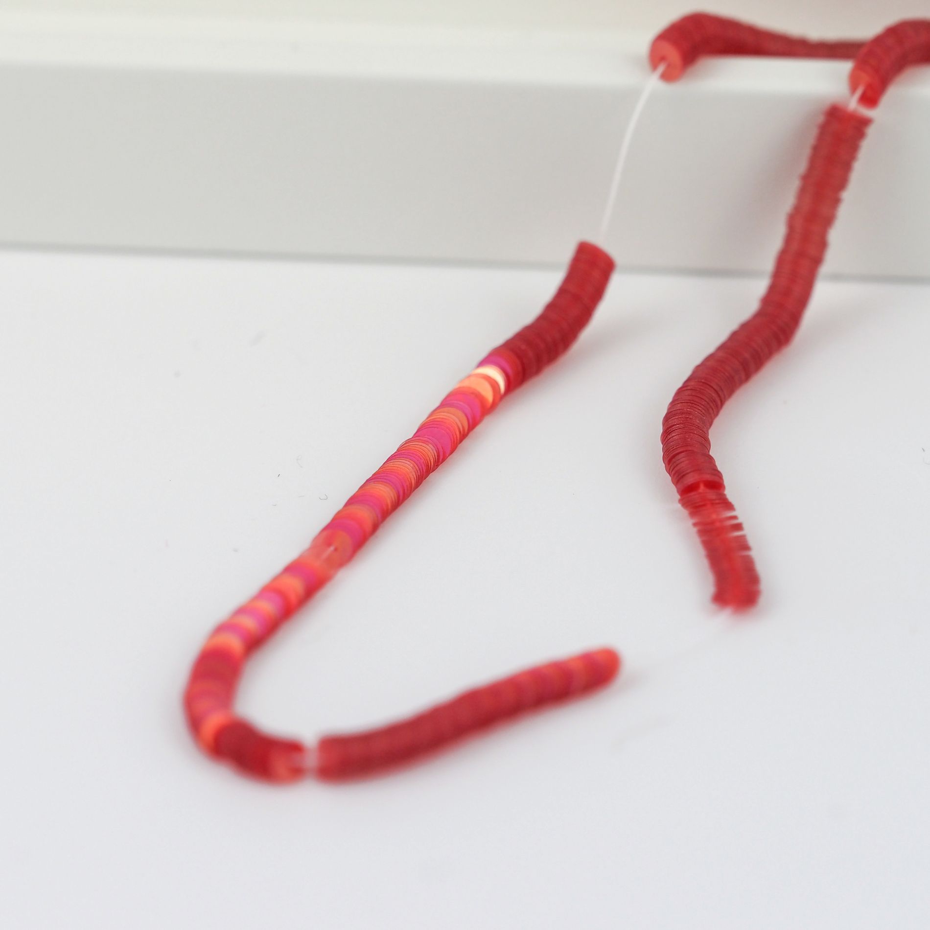 Bright-red-transparent-flat-sequins-4mm-on-string-Italian-embroidery-sequins.jpg