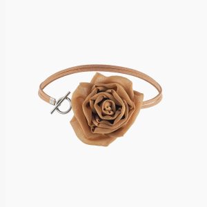 Front view of gold silk rose choker necklace showing suede lace and toggle clasp, centered rose in focus