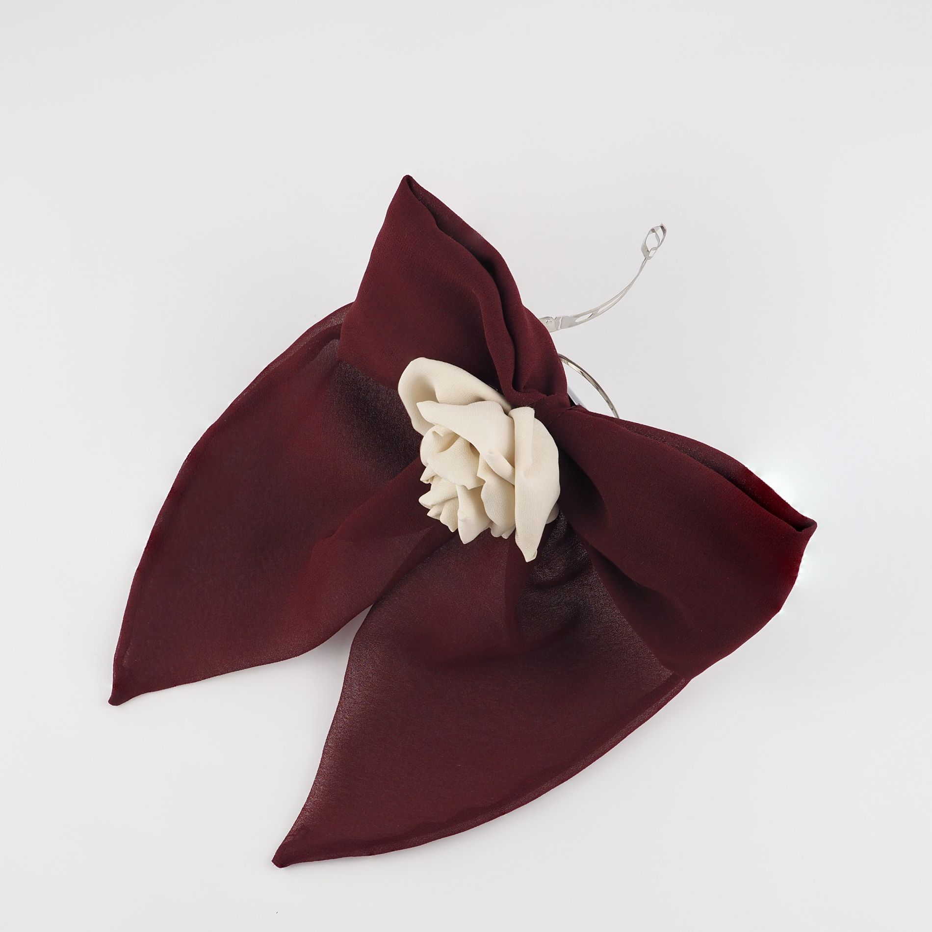 Maroon chiffon bow hair clip side view with silk rose detail