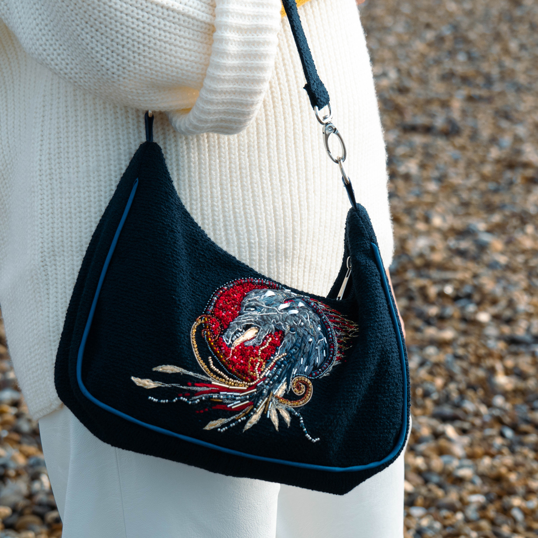 Mini bag with dragon embroidery close-up worn detail