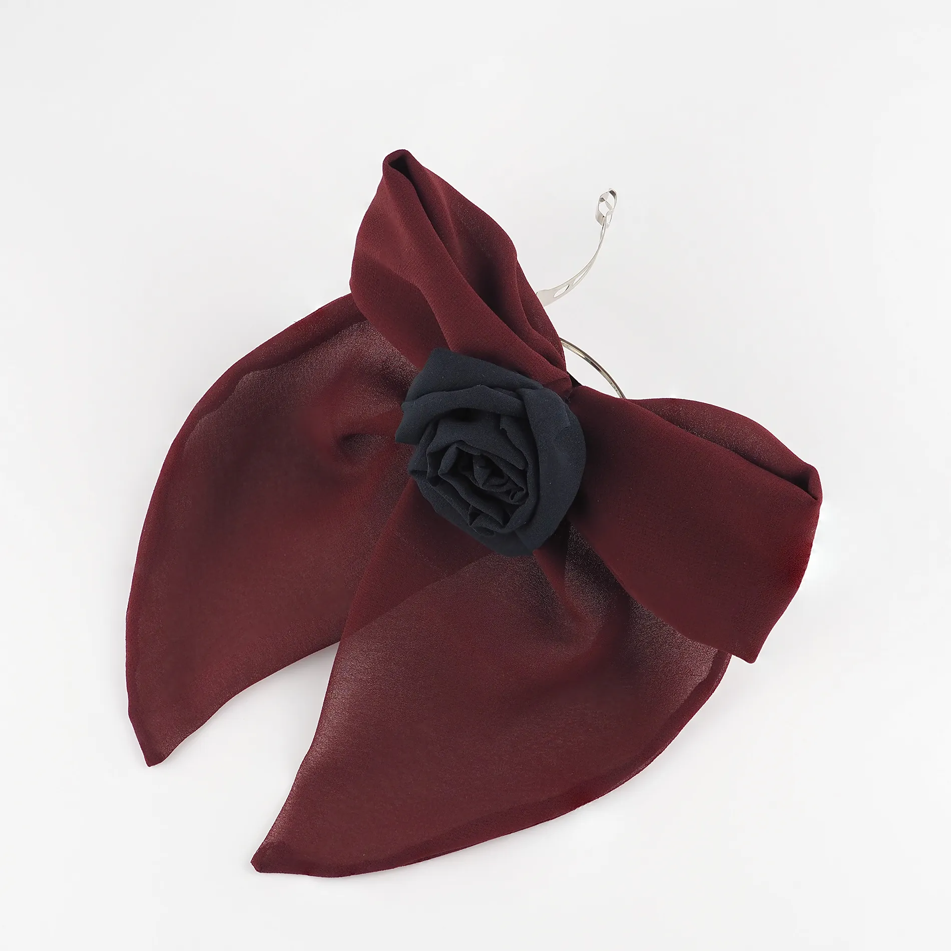 top-view-of-handmade-maroon-bow-hair-clip-with-black-rose